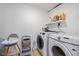 Functional laundry room with modern front-load washer and dryer at 522 31St W St, Bradenton, FL 34205