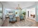 Spacious living room featuring two chairs, wood floors, and ample natural light from the large window at 522 31St W St, Bradenton, FL 34205
