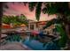 Tropical backyard with a luxurious pool, spa, and patio area, perfect for outdoor entertaining at 522 31St W St, Bradenton, FL 34205