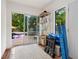 Bright pool room with sliding glass doors to the brick-paved patio and in-ground pool at 522 31St W St, Bradenton, FL 34205