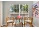 Relaxing sitting area featuring a charming wicker furniture and a view of the lush landscape at 522 31St W St, Bradenton, FL 34205