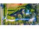 Stunning aerial view of the estate with a private pond and lush landscaping at 5311 36Th E Ave, Palmetto, FL 34221