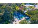 Aerial view of a fenced pickleball court with surrounding greenery and mature trees at 5311 36Th E Ave, Palmetto, FL 34221