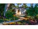 Landscaped backyard featuring a cozy shed and meticulously maintained garden at 5311 36Th E Ave, Palmetto, FL 34221