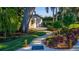 Charming backyard with lush greenery, a winding walkway and a shed at 5311 36Th E Ave, Palmetto, FL 34221
