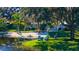 Beautiful Florida home with a beach area, mature trees, and inviting outdoor seating at 5311 36Th E Ave, Palmetto, FL 34221