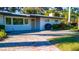 Charming single-story home with a well-maintained lawn and brick paver driveway at 5311 36Th E Ave, Palmetto, FL 34221