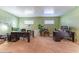 Gathering room with wood paneled walls, neutral carpet, built-in desks, and overhead lighting at 5311 36Th E Ave, Palmetto, FL 34221