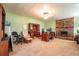 Well-lit Gathering room with a brick fireplace and built-in desk area at 5311 36Th E Ave, Palmetto, FL 34221