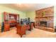 Bright Gathering room featuring wood-paneled walls, a brick fireplace, and multiple desks at 5311 36Th E Ave, Palmetto, FL 34221