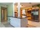 Modern kitchen featuring updated appliances, natural wood cabinetry and a breakfast bar at 5311 36Th E Ave, Palmetto, FL 34221