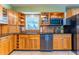 Renovated kitchen area with stainless appliances, open shelving, tile backsplash, and sink with window at 5311 36Th E Ave, Palmetto, FL 34221