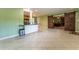 Living room with tile floor and open to updated kitchen with breakfast bar seating at 5311 36Th E Ave, Palmetto, FL 34221