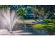 Inviting pond with a fountain and seating area, creating a peaceful outdoor setting at 5311 36Th E Ave, Palmetto, FL 34221