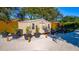 Backyard shed, gravel area, and potted plants with a charming, organized space at 5311 36Th E Ave, Palmetto, FL 34221