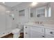 Bright bathroom featuring a vanity with stone countertops and a frameless glass shower at 538 Canal Rd, Sarasota, FL 34242