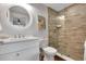 Stylish bathroom featuring a vanity with solid surface countertop and tiled glass shower at 538 Canal Rd, Sarasota, FL 34242