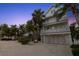 Beautiful two-story beach house with multiple balconies, a two-car garage, and tropical landscaping at 538 Canal Rd, Sarasota, FL 34242