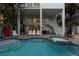 Backyard pool and jacuzzi area with outdoor seating and entertainment space with access to the multiple levels at 538 Canal Rd, Sarasota, FL 34242