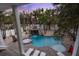 Aerial view of backyard pool with hot tub, waterfall feature, and lounge seating at 538 Canal Rd, Sarasota, FL 34242