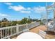 Rooftop deck features coastal views, a spiral staircase, and outdoor seating at 538 Canal Rd, Sarasota, FL 34242