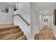 Stylish stairway with wood-look flooring, wainscoting, and easy access to upper and lower levels at 538 Canal Rd, Sarasota, FL 34242