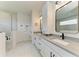 Bathroom featuring double sinks, granite countertops, sleek black faucets and fixtures and glass enclosed shower at 5428 Title Row Dr, Bradenton, FL 34210
