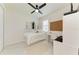 Bedroom with a daybed, built in shelving, shutters, and small desk with rolling chair at 5428 Title Row Dr, Bradenton, FL 34210