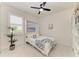 Bright bedroom featuring a built-in murphy bed, a ceiling fan, and built in bookshelves at 5428 Title Row Dr, Bradenton, FL 34210