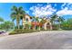 Beautiful community clubhouse with stucco exterior, terracotta roof tiles, and a well-manicured landscape at 5428 Title Row Dr, Bradenton, FL 34210