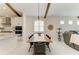 Open-concept dining area with a view of the kitchen and living room at 5428 Title Row Dr, Bradenton, FL 34210