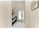 Bright foyer featuring marble floors, console table, and a modern decorative art piece at 5428 Title Row Dr, Bradenton, FL 34210