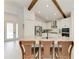 Spacious kitchen featuring a large island with seating, white cabinets, and stainless steel appliances at 5428 Title Row Dr, Bradenton, FL 34210