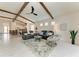 Spacious living room features vaulted ceilings, exposed beams, and marble floors at 5428 Title Row Dr, Bradenton, FL 34210