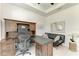 Bright office features a wooden desk and hutch, and a loveseat at 5428 Title Row Dr, Bradenton, FL 34210