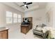 Bright office featuring a wooden desk and hutch, and a loveseat at 5428 Title Row Dr, Bradenton, FL 34210