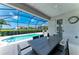 A private swimming pool set against a backdrop of beautiful landscaping and lake views at 5428 Title Row Dr, Bradenton, FL 34210