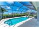 A private swimming pool set against a backdrop of beautiful landscaping and lake views at 5428 Title Row Dr, Bradenton, FL 34210