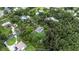 Aerial view showing the home with a large lot surrounded by mature trees in a quiet neighborhood at 5430 Richardson Rd, Sarasota, FL 34232