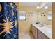 Bathroom with long vanity and a shower featuring a decorative shower curtain at 5430 Richardson Rd, Sarasota, FL 34232