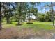 Quaint single story home with large trees and a spacious front yard at 5430 Richardson Rd, Sarasota, FL 34232