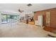 Bright living space open to the kitchen features a decorative brick wall and access to the backyard at 5430 Richardson Rd, Sarasota, FL 34232