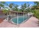 Backyard features a private pool with a safety fence, offering a relaxing outdoor space at 5430 Richardson Rd, Sarasota, FL 34232