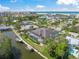Aerial view showcases waterfront property featuring screened-in pool and boat docks at 5569 Cape Leyte Dr, Sarasota, FL 34242