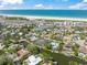 Community aerial showcasing waterfront living, lush landscaping and close beach access at 5569 Cape Leyte Dr, Sarasota, FL 34242