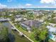 Stunning aerial view of a home on a waterfront property with a screened-in pool and boat dock at 5569 Cape Leyte Dr, Sarasota, FL 34242