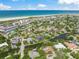 Community aerial showcasing waterfront living, lush landscaping and close beach access at 5569 Cape Leyte Dr, Sarasota, FL 34242