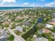 Community aerial showcasing waterfront living, lush landscaping and close beach access at 5569 Cape Leyte Dr, Sarasota, FL 34242