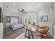 Charming bedroom featuring a built-in Murphy bed, ample storage, and great natural light from the three windows at 5569 Cape Leyte Dr, Sarasota, FL 34242