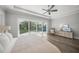 Inviting bedroom features hardwood floors, a ceiling fan, and natural light at 5569 Cape Leyte Dr, Sarasota, FL 34242